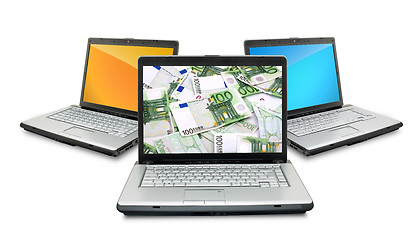 Image showing Open laptops with money 