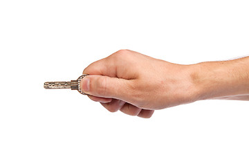 Image showing Male hand holding a key to the house