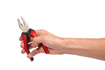 Image showing Male hand hold a black and red pliers