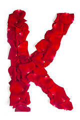 Image showing Letter K made from red petals rose on white