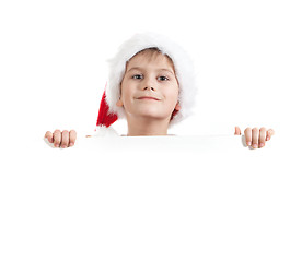 Image showing Boy holding a christmas poster 