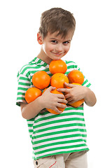 Image showing Boy holding oranges