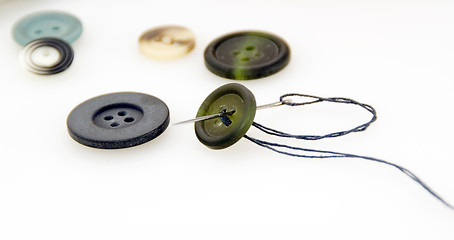 Image showing Some buttons and needle