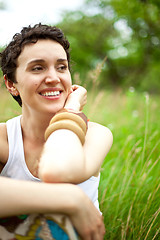 Image showing girl resting on fresh spring grass 