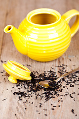 Image showing teapot with spoon and tea