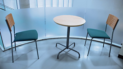 Image showing two chairs and round table