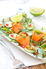 Image showing Smoked salmon with pomegranate and rocket salad