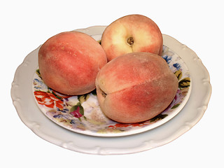 Image showing Three peaches