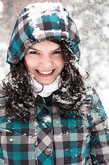 Image showing Out of focus picture of a woman with a lot of snowflakes