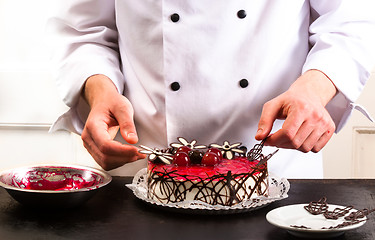 Image showing Confectioner and a cake