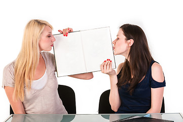 Image showing Two beautiful student girls getting ready for school