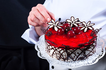 Image showing Confectioner and a cake