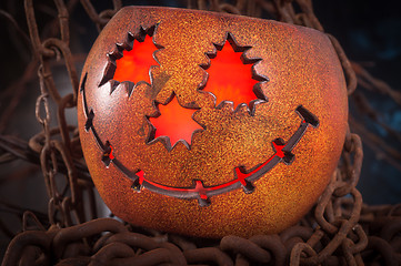 Image showing Orange pumkin on chains