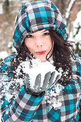 Image showing Woman blowing snow in my face