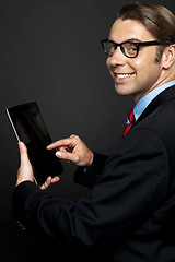 Image showing Young business manager working on his tablet pc