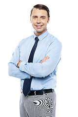 Image showing Smiling business representative posing, arms folded