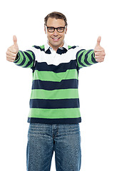 Image showing Cool guy showing double thumbs up to camera