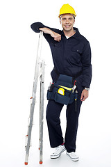 Image showing Industrial engineer resting his hands on stepladder