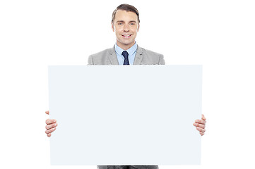 Image showing Business representative holding white billboard