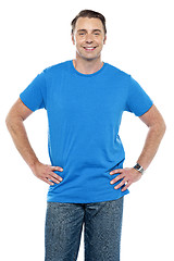 Image showing Casual guy posing, hands on his waist