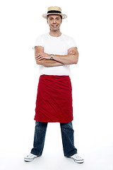 Image showing Stylish chap wearing hat. Apron tied on his waist