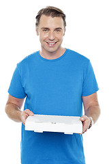 Image showing Hungry man holding pizza box