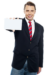 Image showing Confident sales representative presenting blank placard