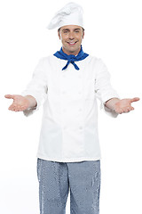 Image showing Smiling chef posing with his arms wide open