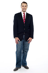 Image showing Ful length portrait of young businessman in jeans