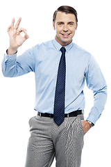 Image showing Team leader gesturing okay sign to his subordinates