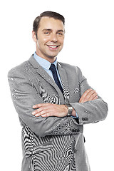 Image showing Male consultant smiling with his arms crossed