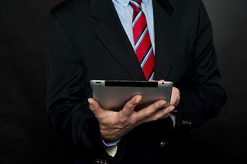 Image showing Cropped image of businessman browsing tablet pc