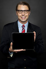 Image showing Male representative sharing newly launched tablet