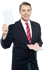 Image showing Executive showing blank playing card to camera