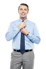 Image showing Sales representative adjusting his tie before the meeting