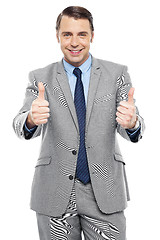 Image showing Handsome executive showing double thumbs up