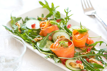 Image showing Smoked salmon with pomegranate and rocket salad