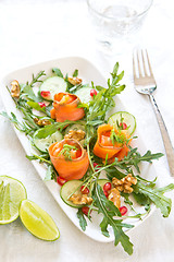 Image showing Smoked salmon with pomegranate and rocket salad