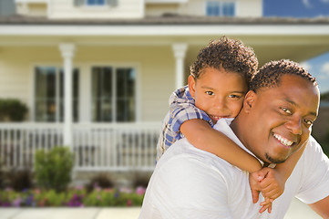 Image showing Mixed Race Father and Son In Front of House