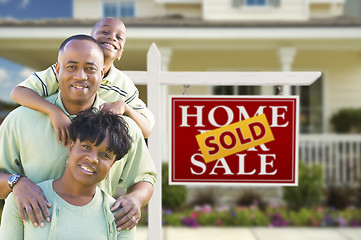 Image showing African American Family In Front of Real Estate Sign and House