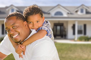 Image showing Mixed Race Father and Son In Front of House