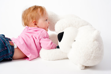 Image showing Baby girl with bear toy