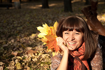 Image showing woman with autumn leaves
