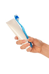 Image showing Toothpaste and blue toothbrush