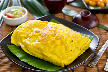 Image showing Stir fried vegetables and coconut wrapped in omelet [Thai's food] 