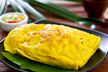 Image showing Stir fried vegetables and coconut wrapped in omelet [Thai's food]