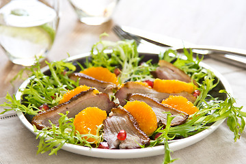 Image showing Smoked duck with orange and pomegranate salad
