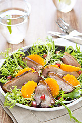Image showing Smoked duck with orange and pomegranate salad