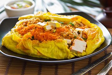 Image showing Stir fried vegetables and coconut wrapped in omelet [Thai's food]