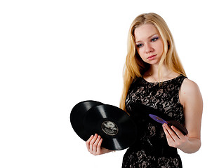 Image showing Pretty girl holding vinyl disc